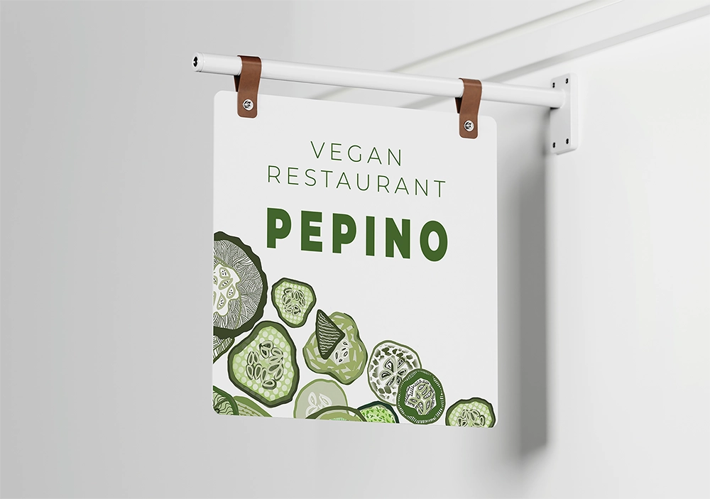 Firmenschild mit Logo Pepino – veganes Restaurant